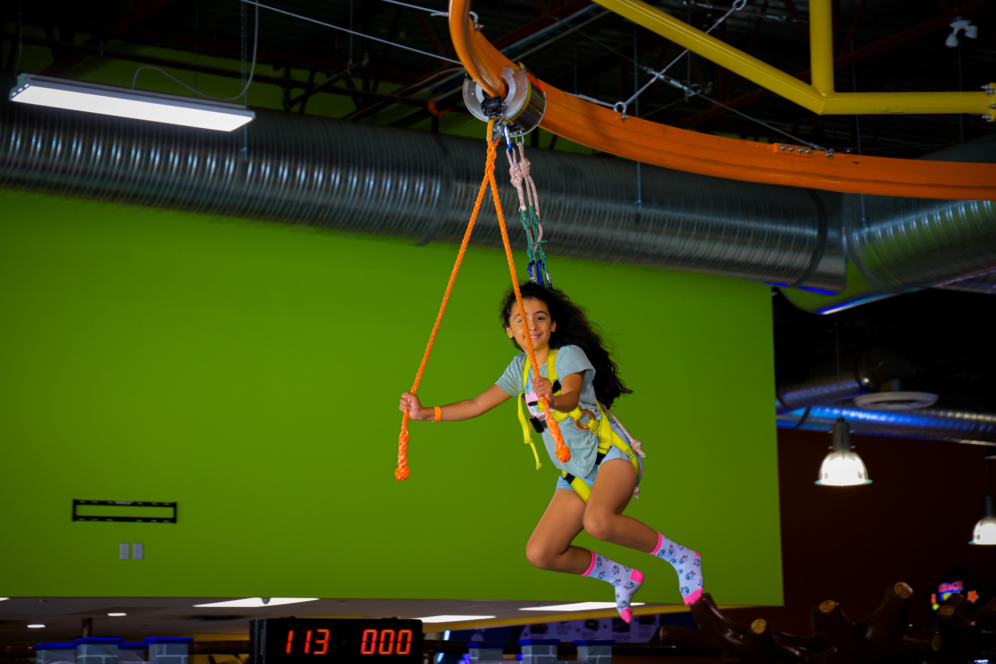 Child riding the Sky Ride Zone